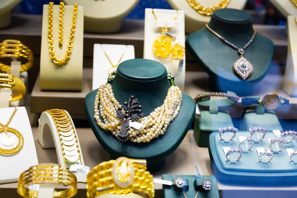 Gold jewelry on the counter of a jewelry store closeup